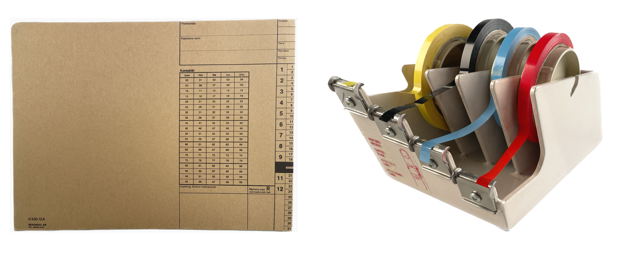 Ett journalkuvert och journaltejp i tejphållare. Den senare ett föremål som ingår i S:t Eriks Ögonsjukhus arkiv.